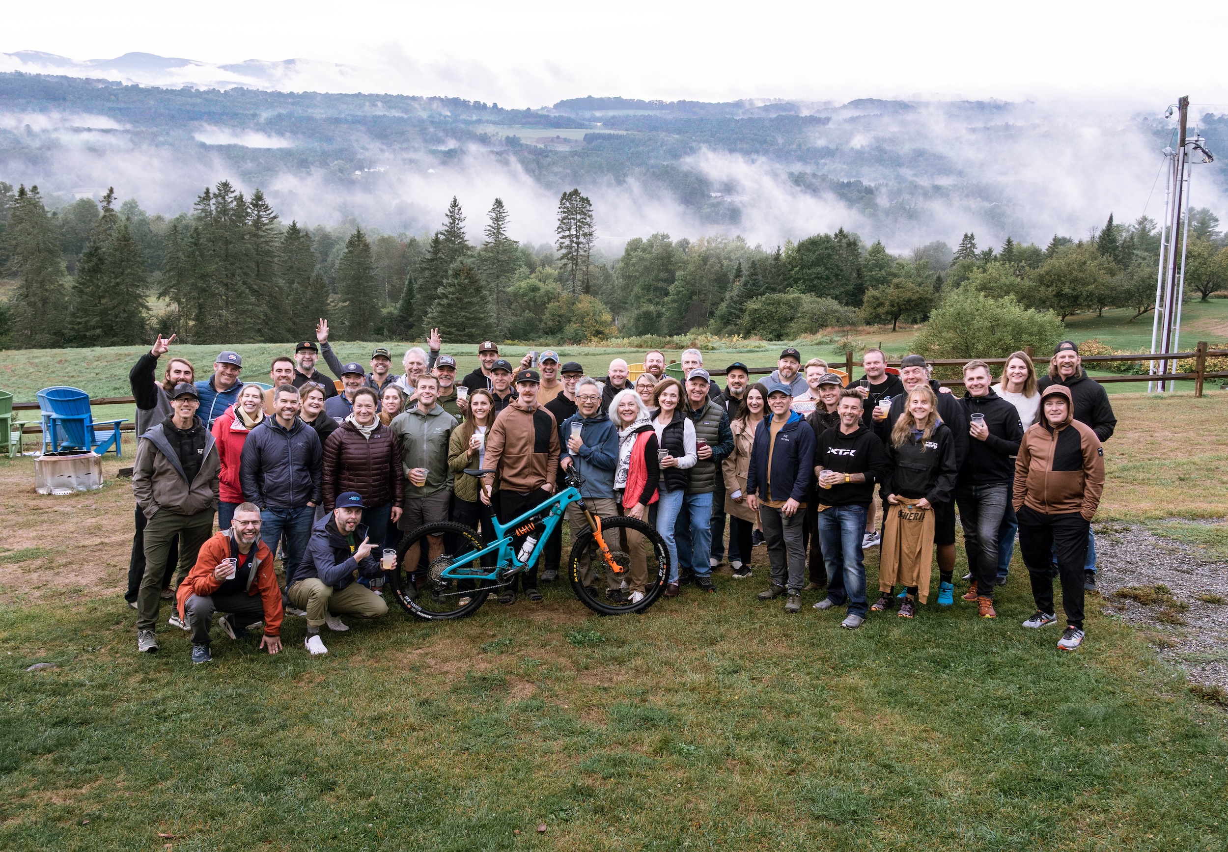 Group photo at Yeti Gathering Vermont 2025 with mountain backdrop and participants enjoying the event. Mountain Bike United.