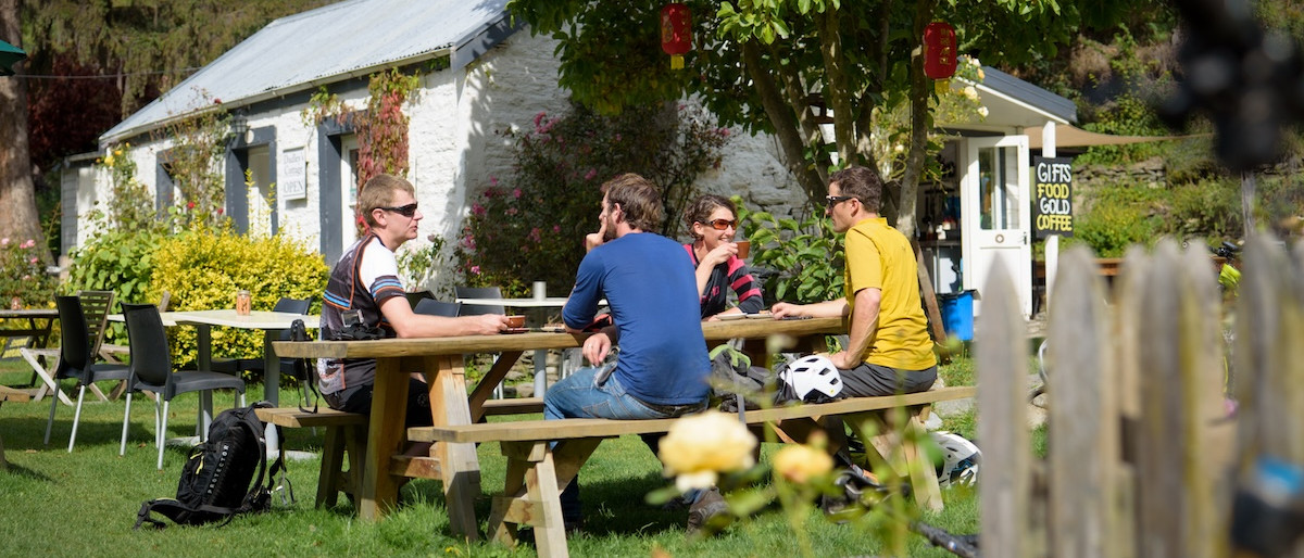 Group relaxing at a caf&eacute; near mountain bike trails. Mountain Bike United.